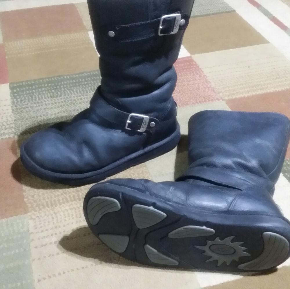 Black leather furlined ugg boots.